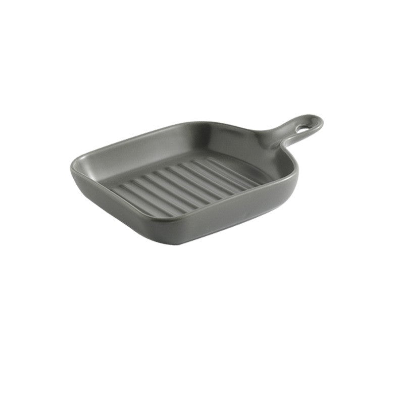 Assiettes Koki VidaXL blanches en céramique avec motif décoratif, empilées sur une surface en bois.