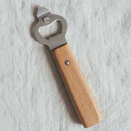 Éplucheur en acier inoxydable avec manche en bois de la marque VidaXL, utilisé pour peler fruits et légumes.
