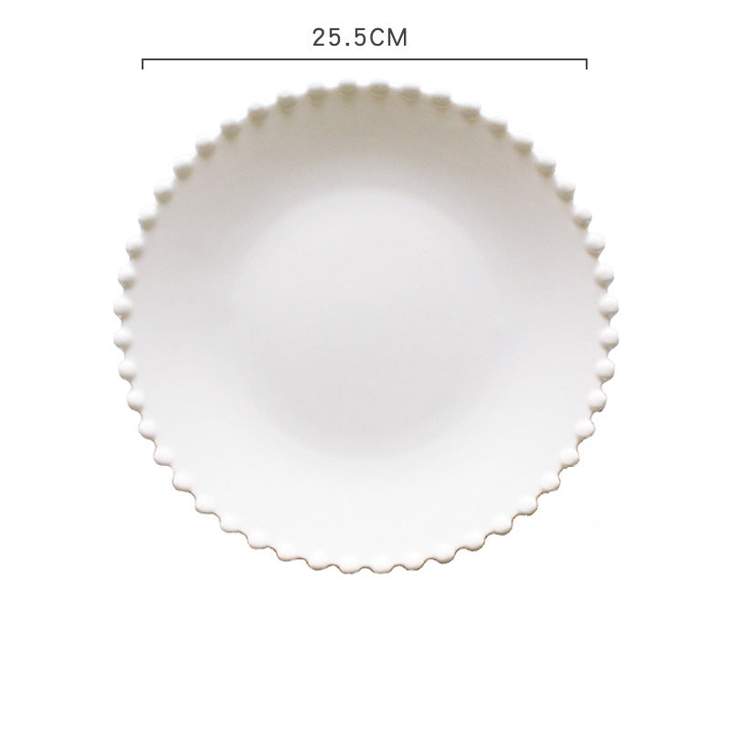 Assiettes en céramique VidaXL Ilé-Ifè, design élégant et moderne, présentées empilées sur une table en bois.