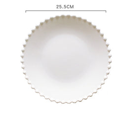 Assiettes en céramique VidaXL Ilé-Ifè, design élégant et moderne, présentées empilées sur une table en bois.