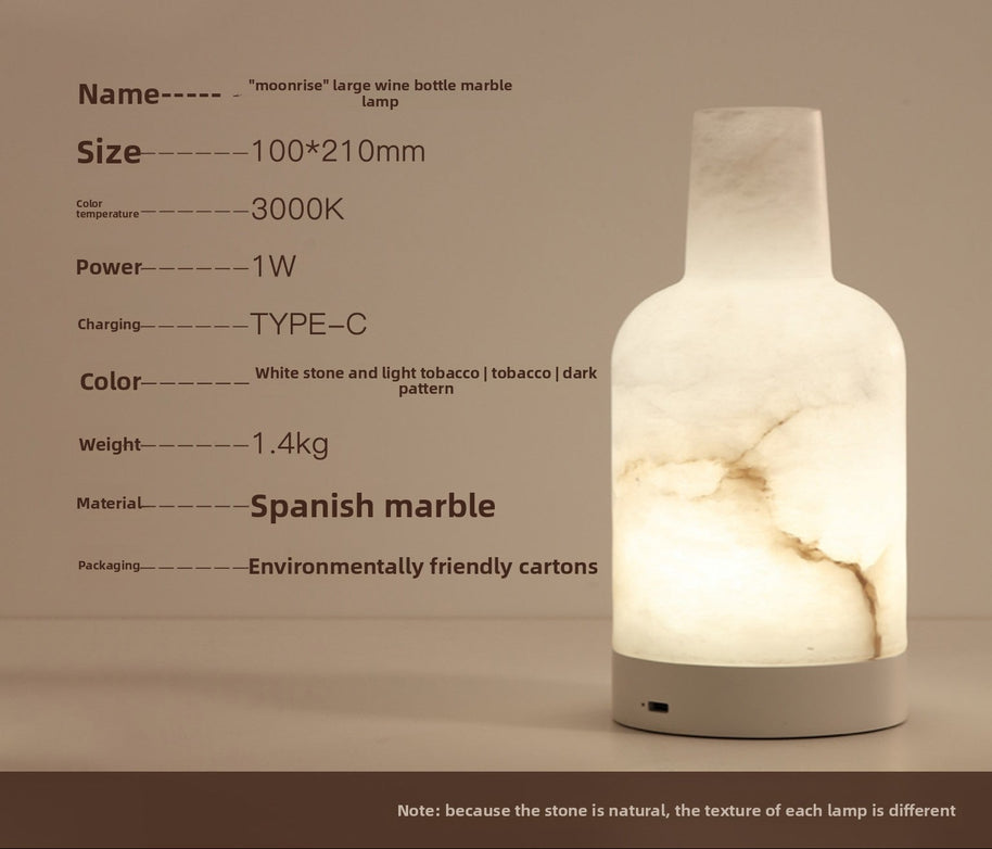 Lampe portable en marbre espagnol Cantoria de la marque HAUSSLYON, avec base en marbre blanc et design élégant.