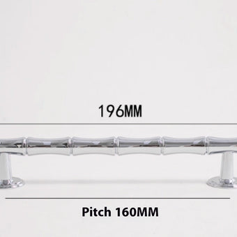 Poignées et boutons Kyotoji en chrome de VidaXL, montrant une finition brillante et un design élégant pour meubles modernes.