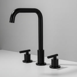 Robinet de salle de bain Haussslyon BUEA en laiton avec poignée moderne, installé dans une salle de bain élégante.