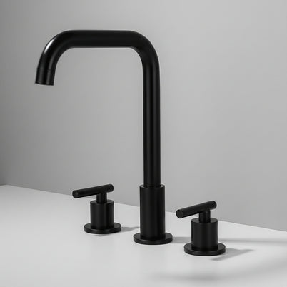 Robinet de salle de bain Haussslyon BUEA en laiton avec poignée moderne, installé dans une salle de bain élégante.