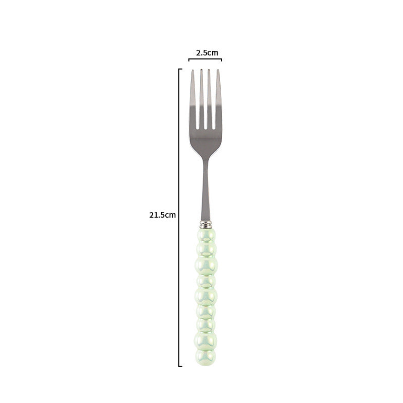 Couverts VidaXL Athenes en acier inoxydable avec fourchette, couteau et cuillère sur un fond neutre.