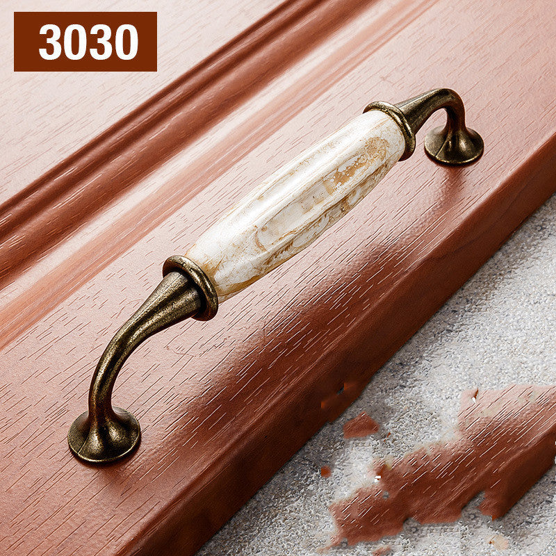 Poignées et boutons Rochelle VidaXL, en métal, de 128 mm, avec fixation centrale, pour meubles ou décoration intérieure.